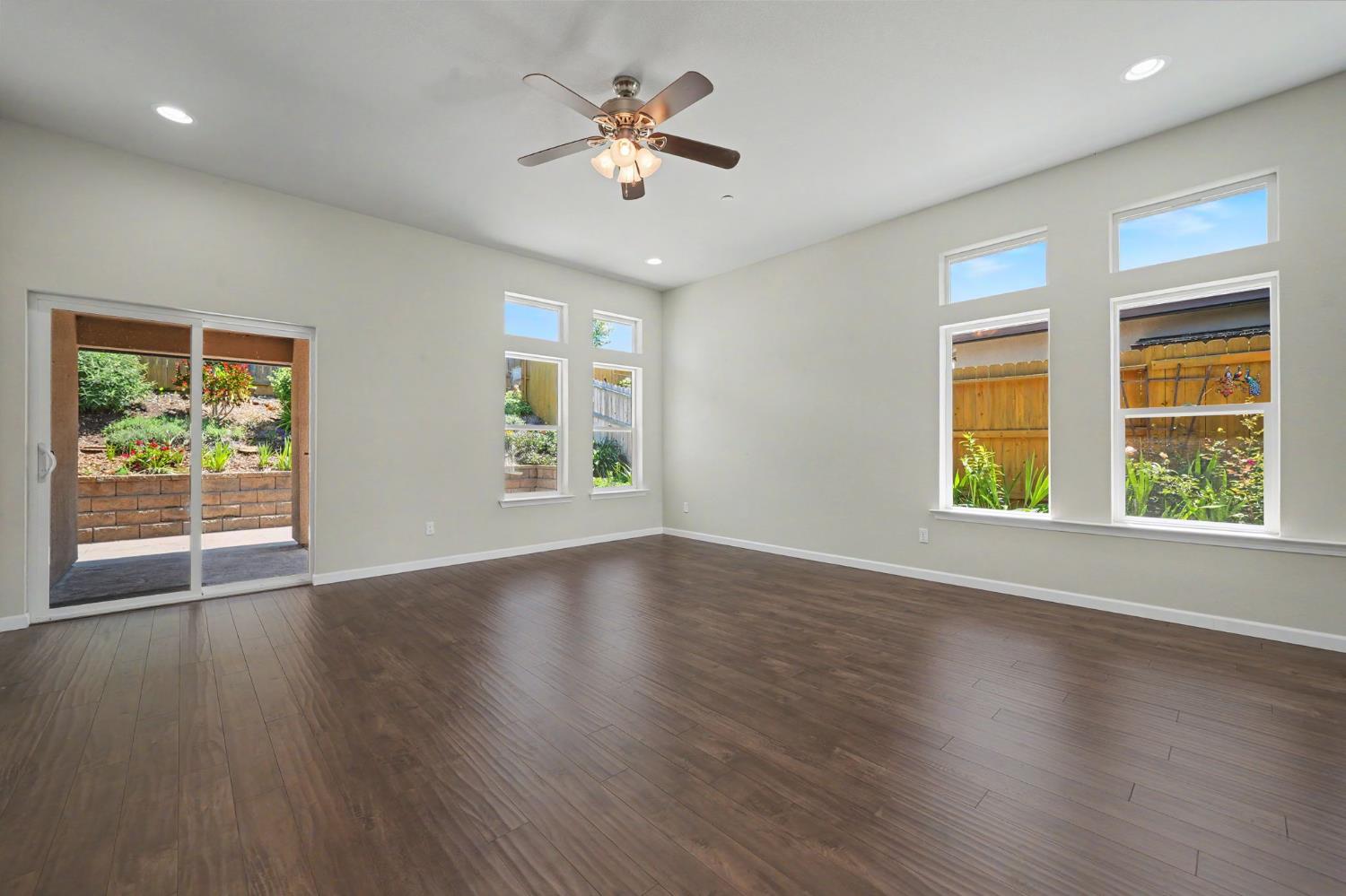 159 Emerald Lane Jackson, CA 95642 - Photo 13 of 58 a view of an empty room with wooden floor and a window