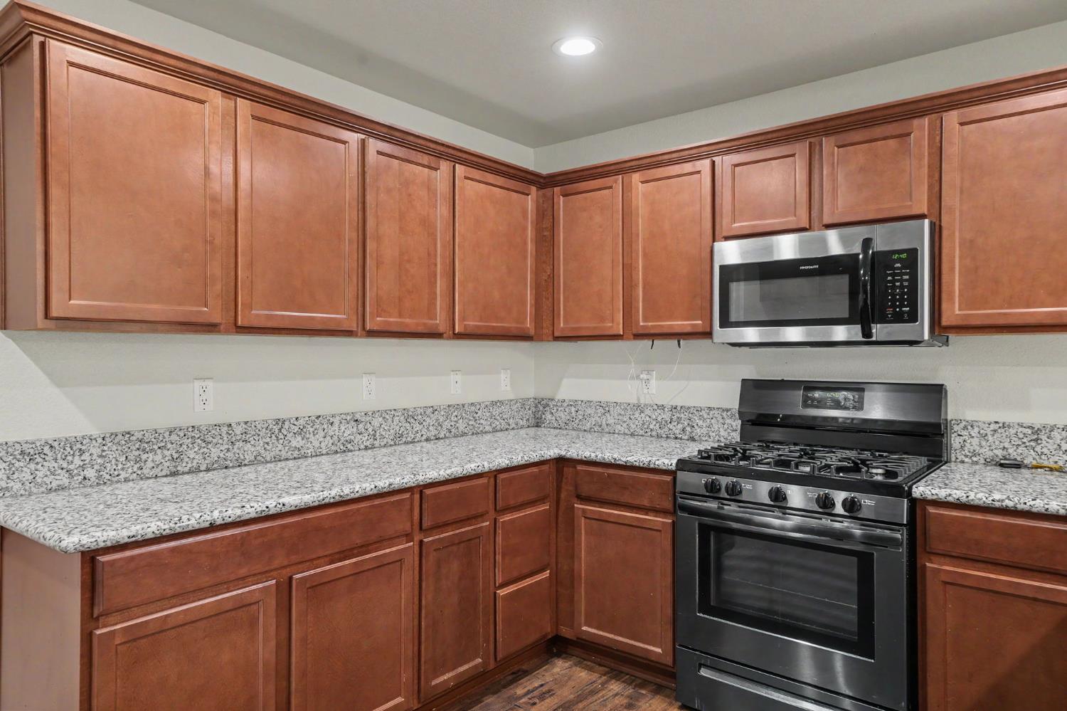 159 Emerald Lane Jackson, CA 95642 - Photo 20 of 58 a kitchen with granite countertop a sink stainless steel appliances and cabinets