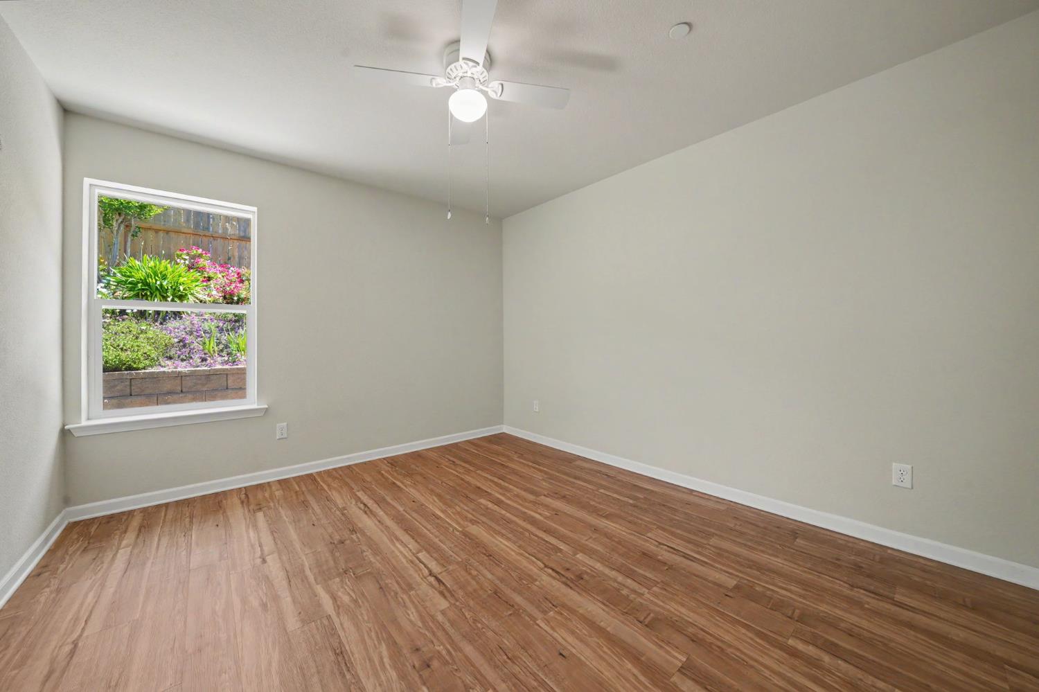 159 Emerald Lane Jackson, CA 95642 - Photo 28 of 58 wooden floor in an empty room with a window
