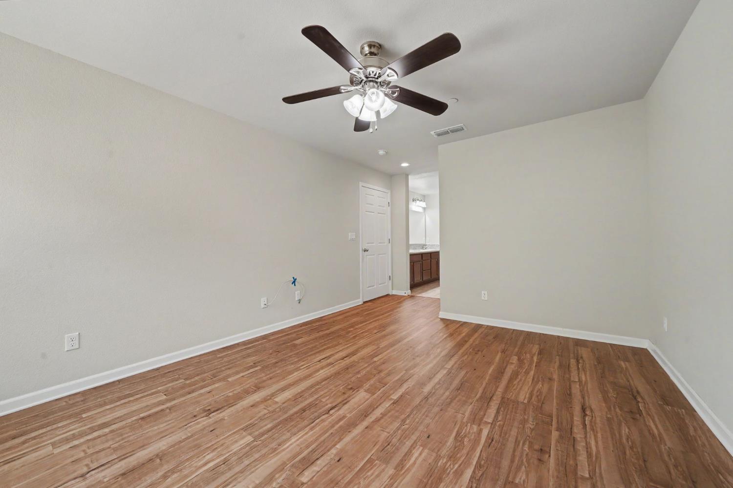 159 Emerald Lane Jackson, CA 95642 - Photo 32 of 58 a view of an empty room with wooden floor