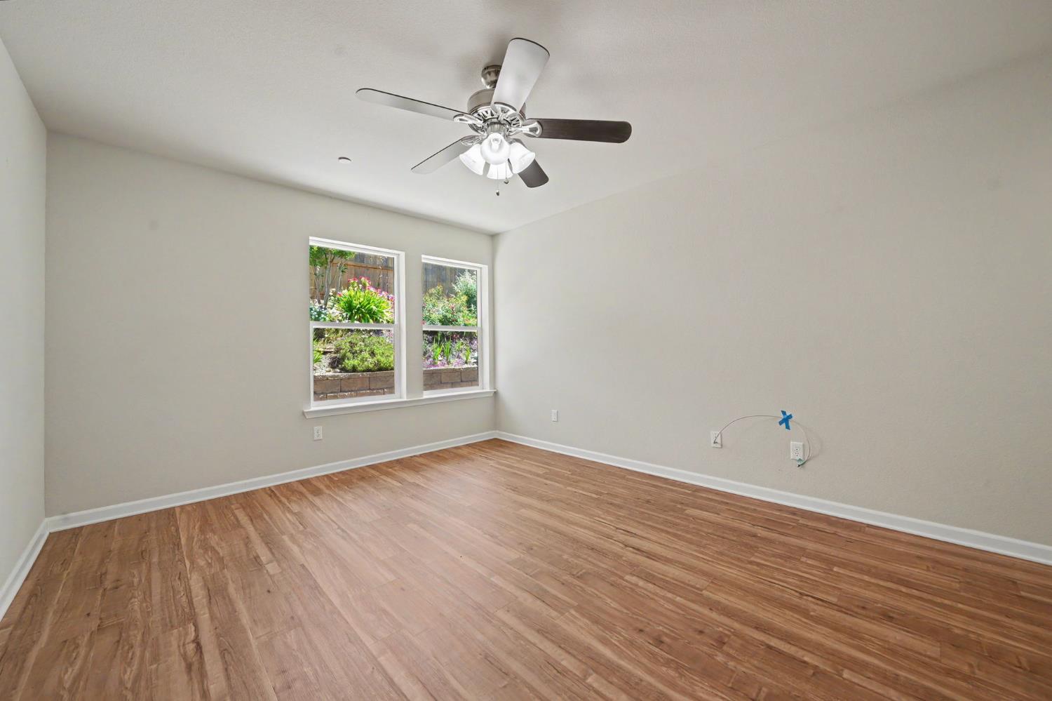 159 Emerald Lane Jackson, CA 95642 - Photo 33 of 58 a view of an empty room with wooden floor and a window