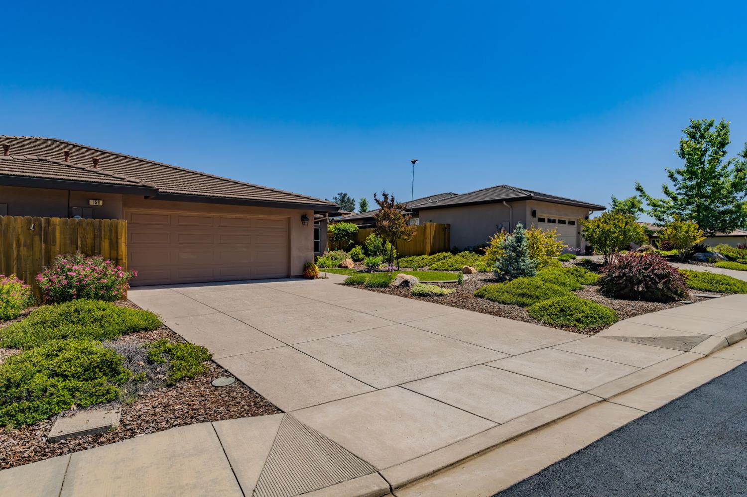 159 Emerald Lane Jackson, CA 95642 - Photo 5 of 58 a front view of a house with a yard and garage