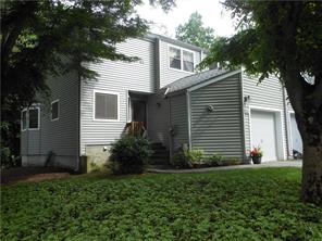 a view of a house with backyard and garden