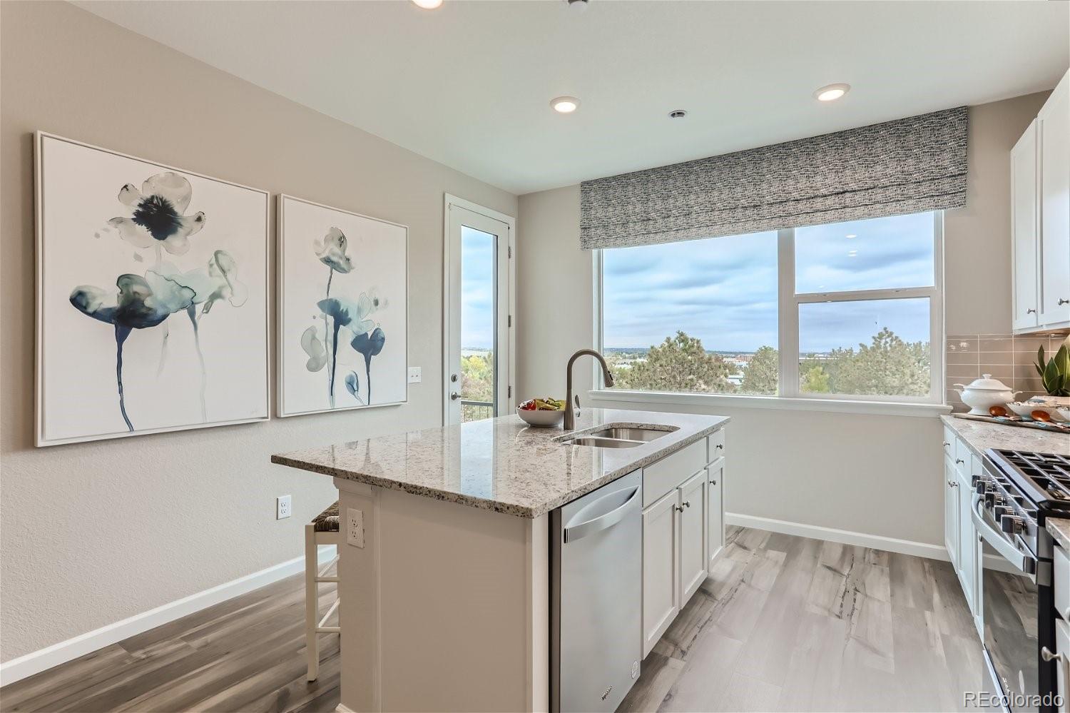 471 Interlocken Boulevard, Unit 101 Broomfield, CO 80021 - Photo 11 of 28 a kitchen with a sink and a window
