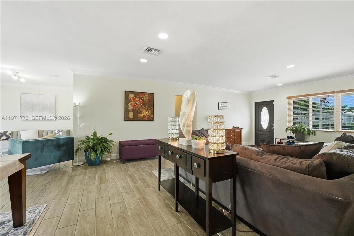 4925 Tyler Street Hollywood, FL 33021 - Photo 19 of 55 a living room with furniture and wooden floor