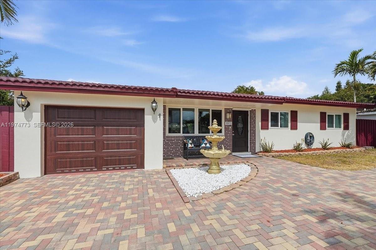 4925 Tyler Street Hollywood, FL 33021 - Photo 3 of 55 a house with yard in front of it