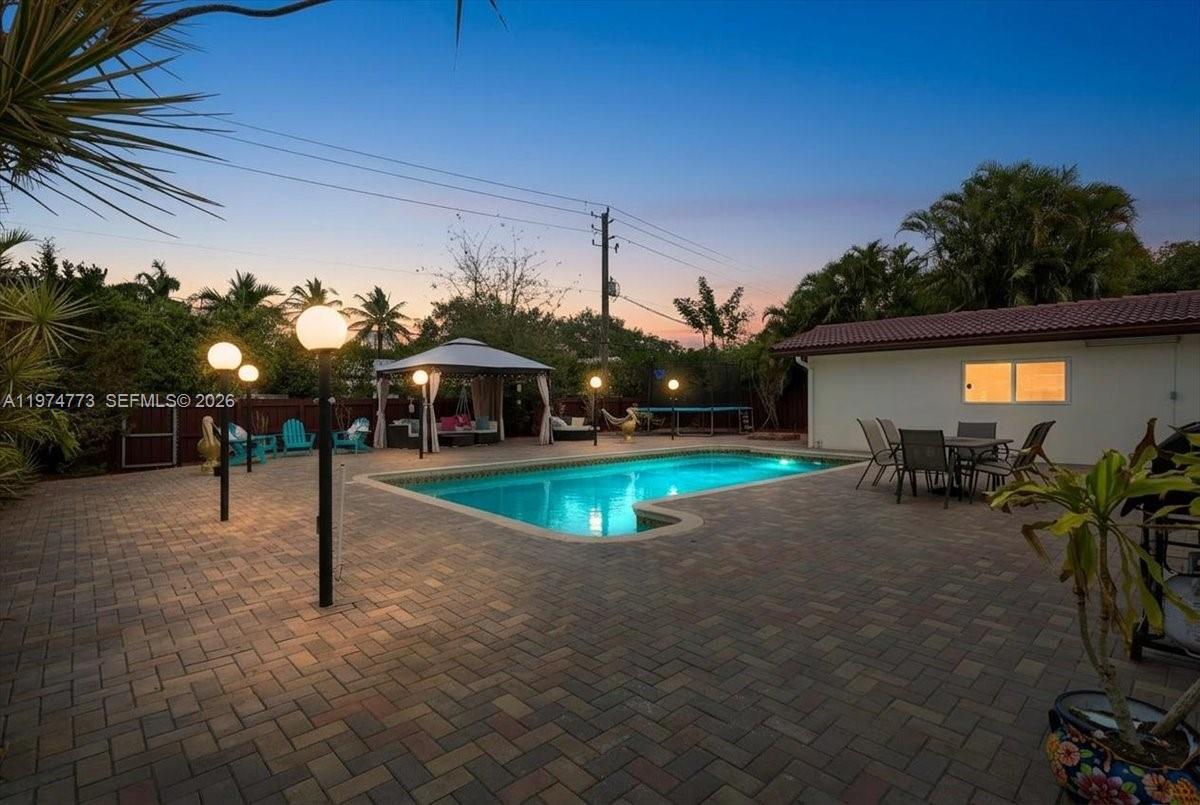 4925 Tyler Street Hollywood, FL 33021 - Photo 4 of 55 a view of a house with a swimming pool