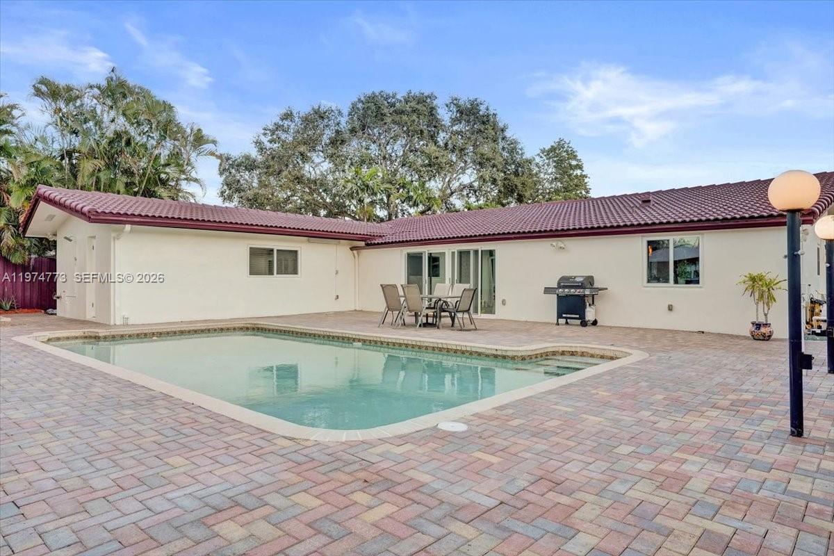 4925 Tyler Street Hollywood, FL 33021 - Photo 46 of 55 a view of a house with swimming pool and sitting area