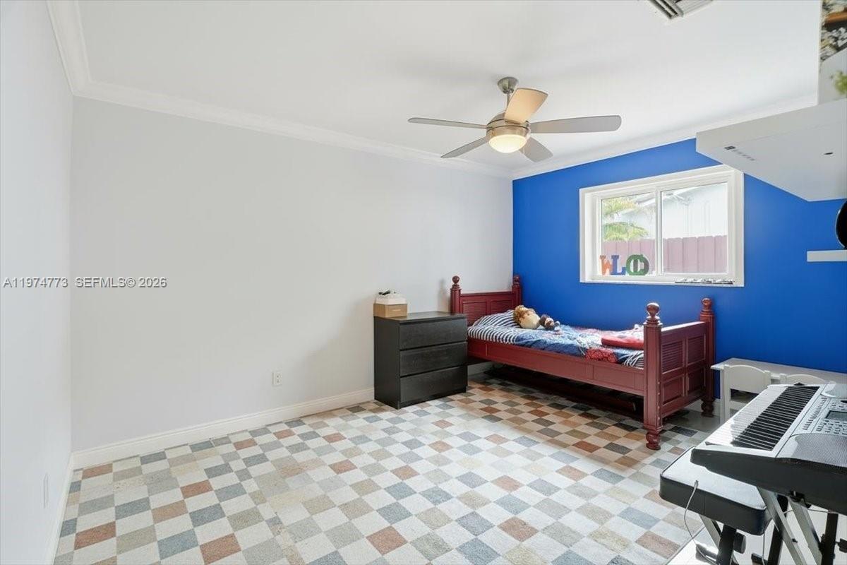 4925 Tyler Street Hollywood, FL 33021 - Photo 54 of 55 a bedroom with furniture and a rug