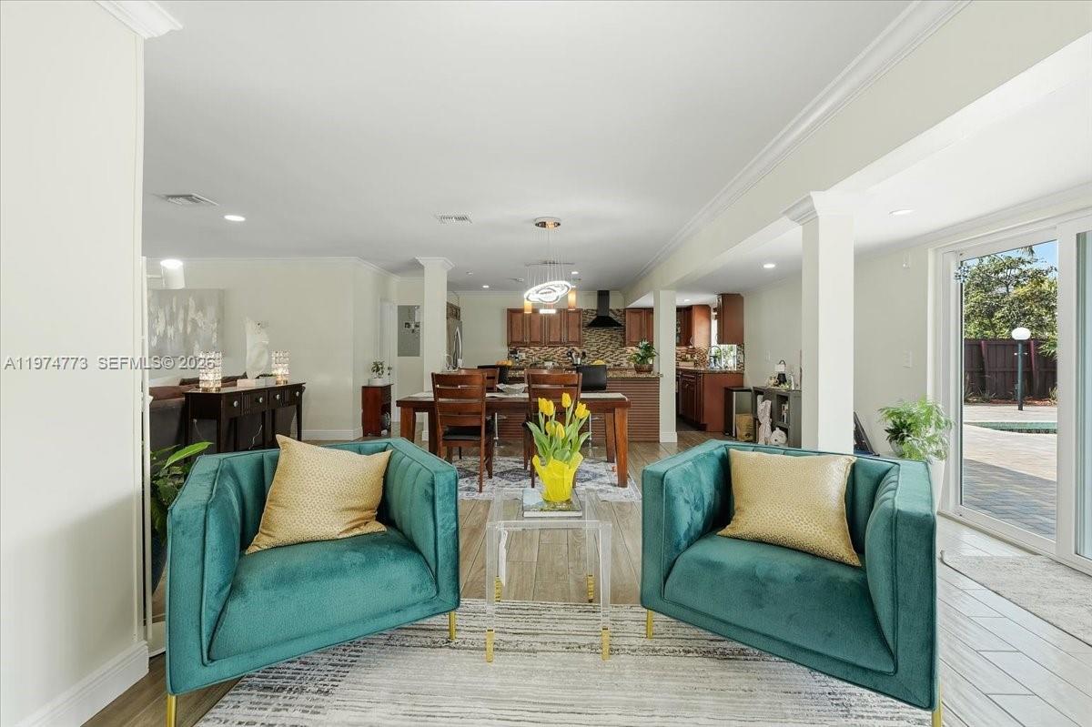 4925 Tyler Street Hollywood, FL 33021 - Photo 7 of 55 a living room with furniture and kitchen view