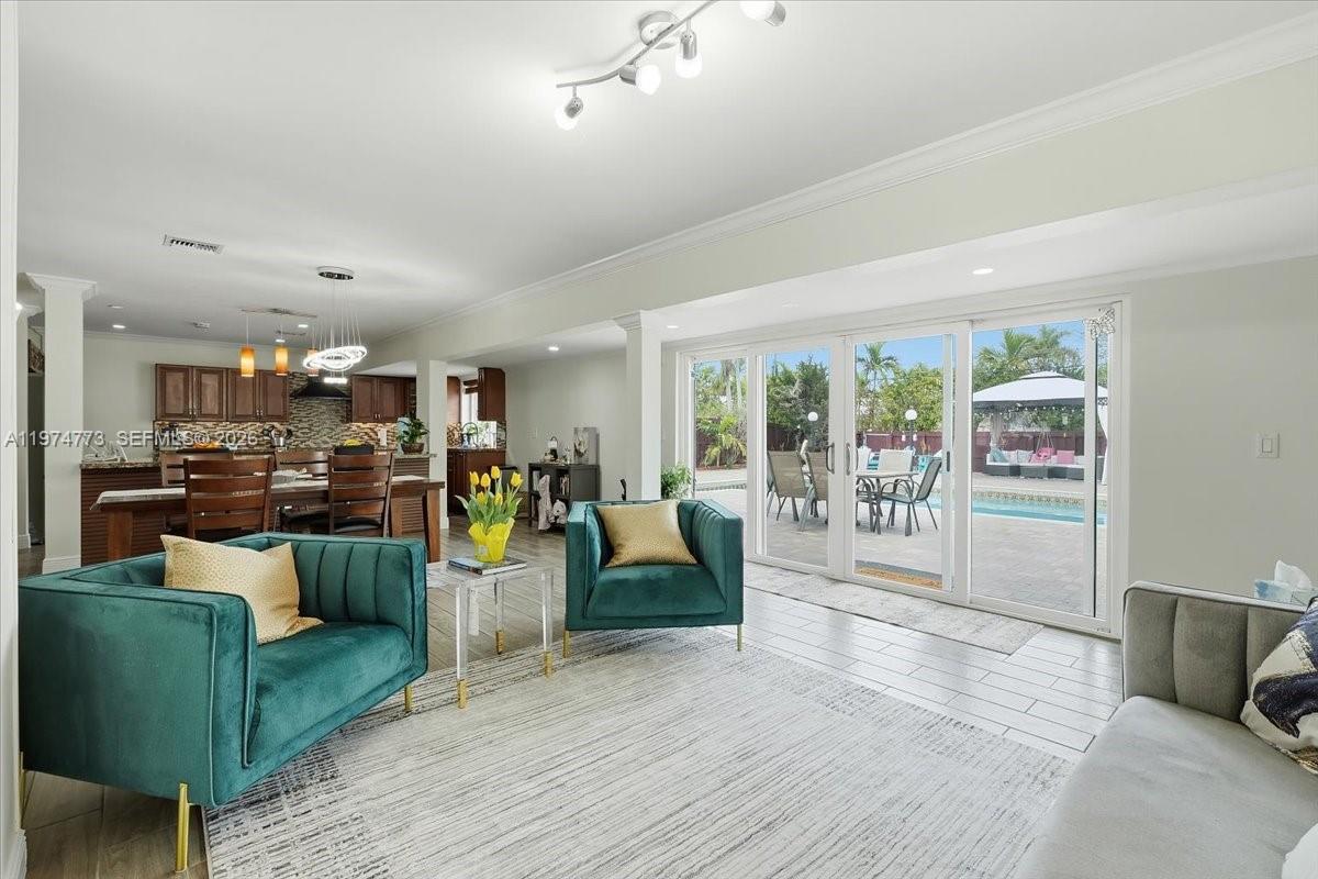 4925 Tyler Street Hollywood, FL 33021 - Photo 8 of 55 a living room with furniture and a wooden floor