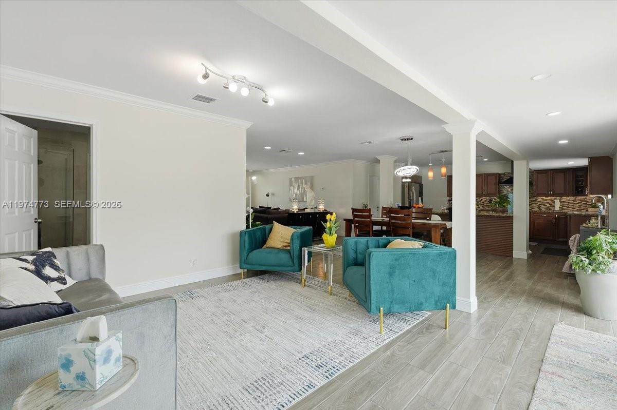 4925 Tyler Street Hollywood, FL 33021 - Photo 9 of 55 a view of a living room and kitchen