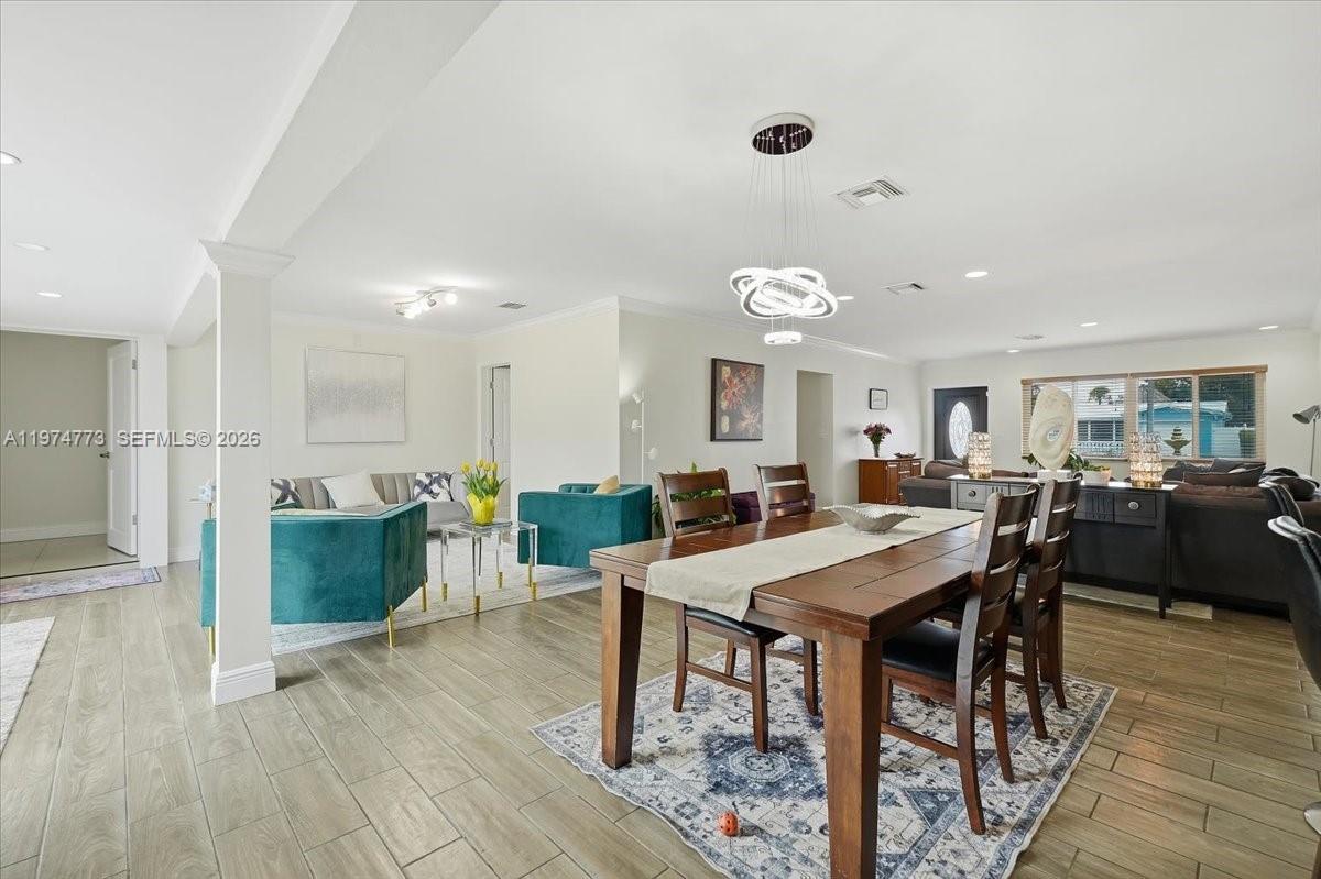 4925 Tyler Street Hollywood, FL 33021 - Photo 10 of 55 a large kitchen with a table and chairs