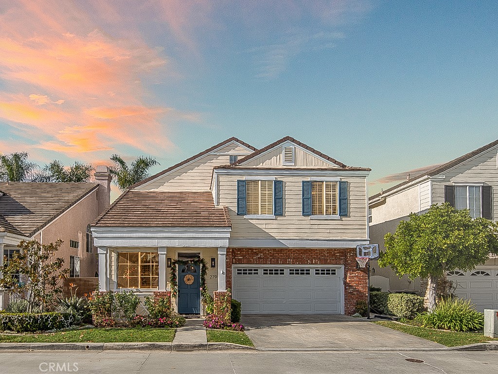 279 Mesa Drive Costa Mesa, CA 92627 - Photo 1 of 1 a front view of a house with a yard and garage