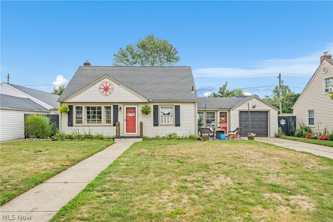 322 Valleyview Avenue Northwest Canton, OH 44708 - Photo 1 of 35 Bungalow-style house with an outdoor structure, a garage, and a front lawn
