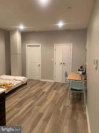 a bedroom with a bed and a table in it
