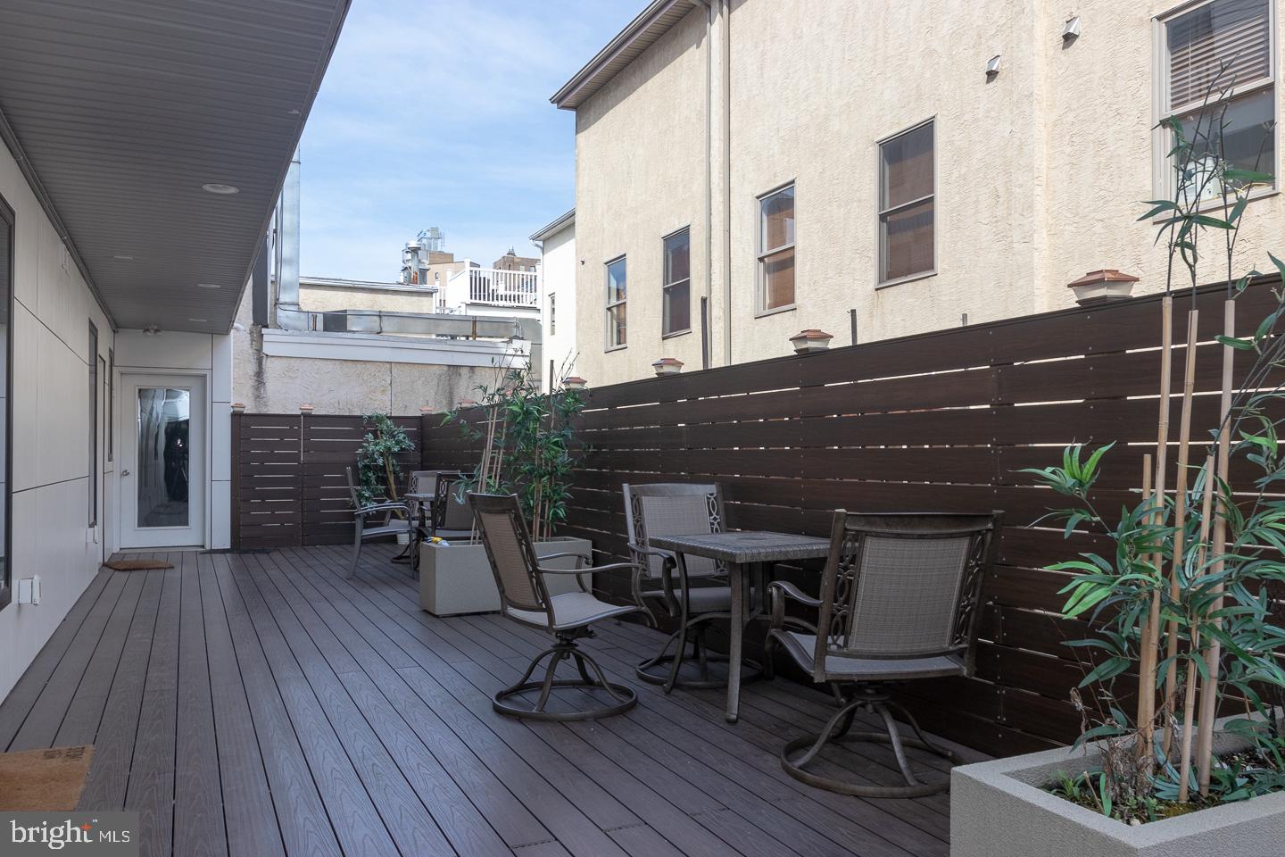 1701 South Street, Unit 1F Philadelphia, PA 19146 - Photo 10 of 11 a view of dinning table and chairs in patio of the house