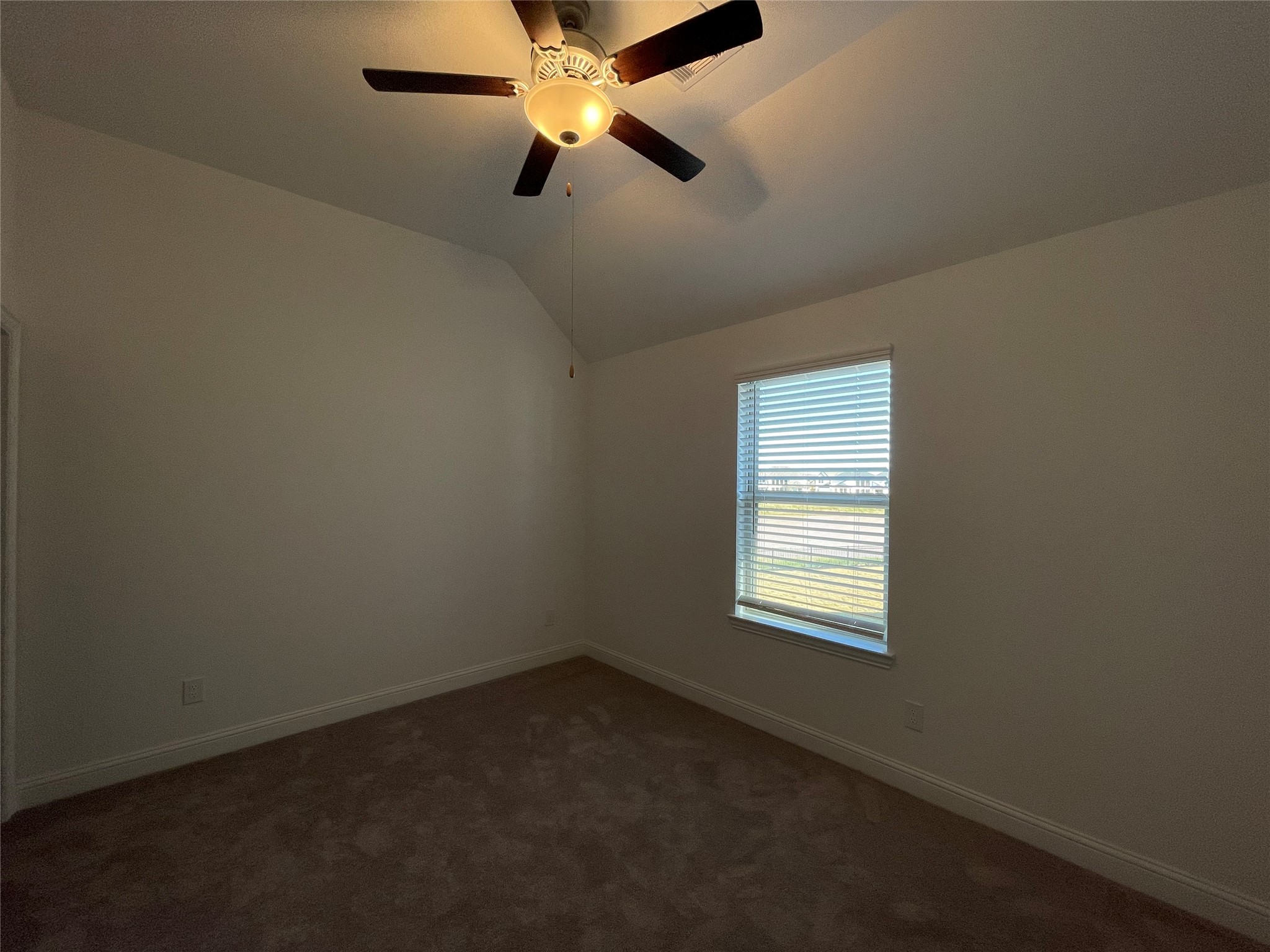 29806 Cherry Vine Road Katy, TX 77494 - Photo 23 of 30 an empty room with a window and a fan