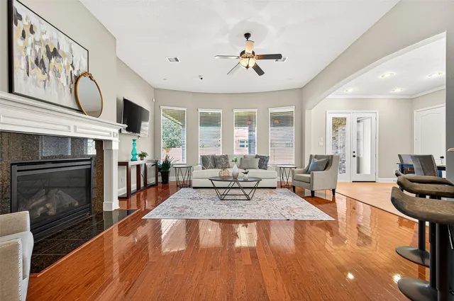 a living room with furniture and a fireplace