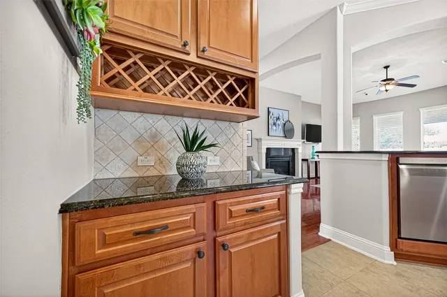 a kitchen with stainless steel appliances granite countertop a stove and a microwave