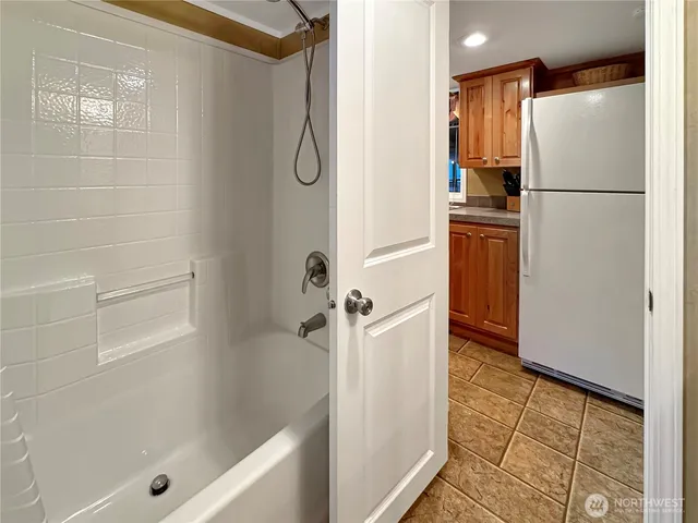 a bathroom with a shower and a sink