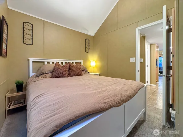 a bedroom with a bed and a couch