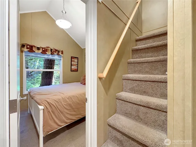 a bed room with a bed and a window