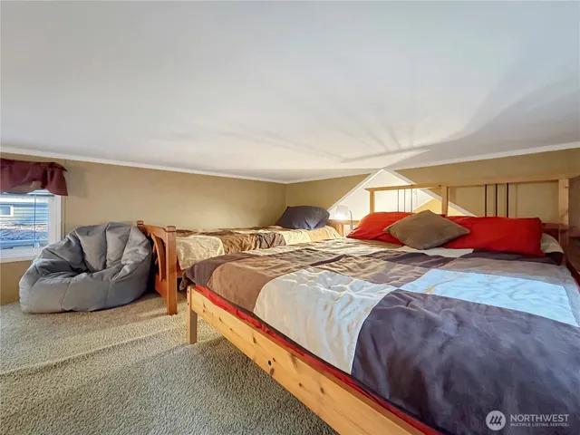 a bedroom with bed and a couch