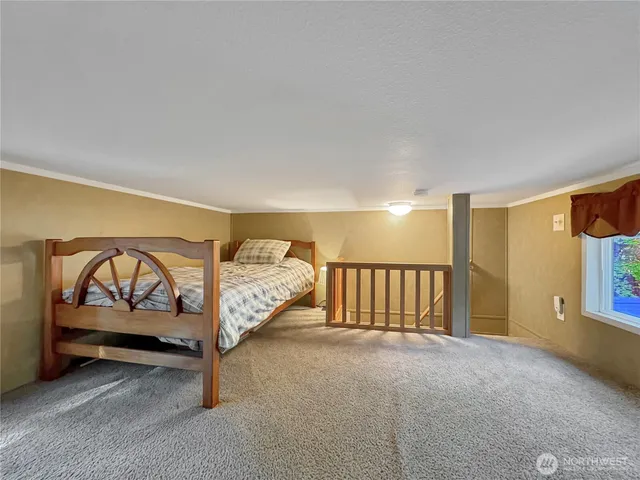 a spacious bedroom with a bed and a view of bathroom