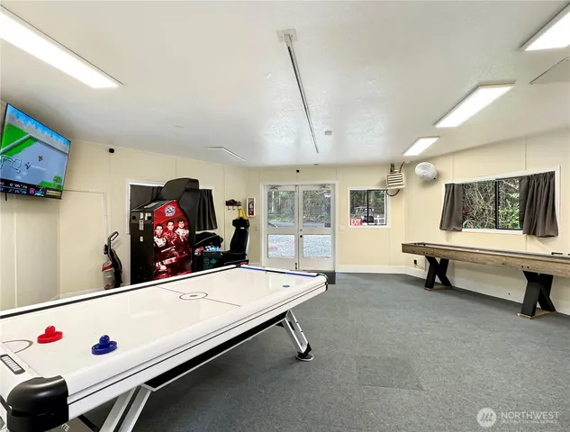a room with furniture and pool table