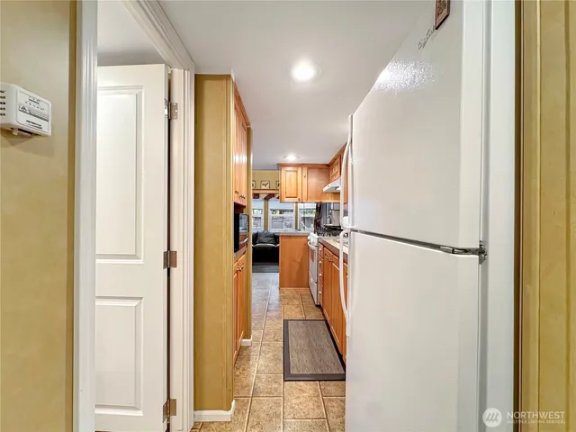 a view of a kitchen from the hallway