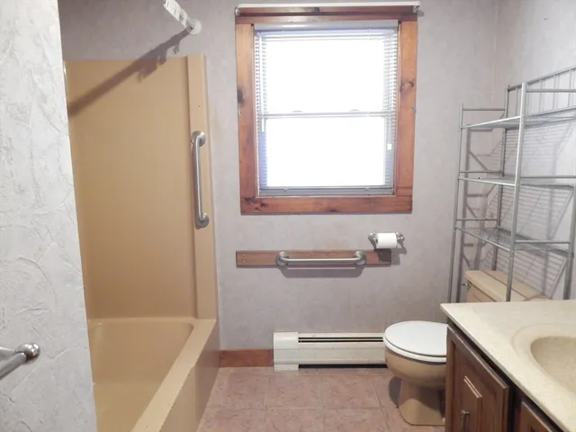 a bathroom with a toilet sink and a bathtub