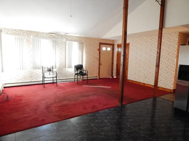 a view of an empty room with windows