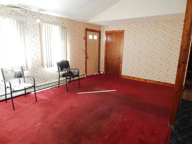 a view of livingroom with furniture and windows