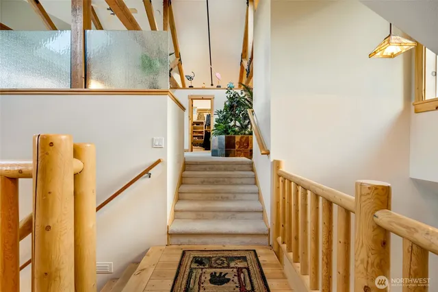 a bed room with a bed and a chair