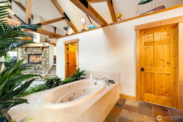 a living room with kitchen area