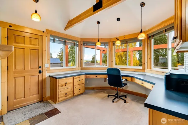 a view of an entryway and wooden floor