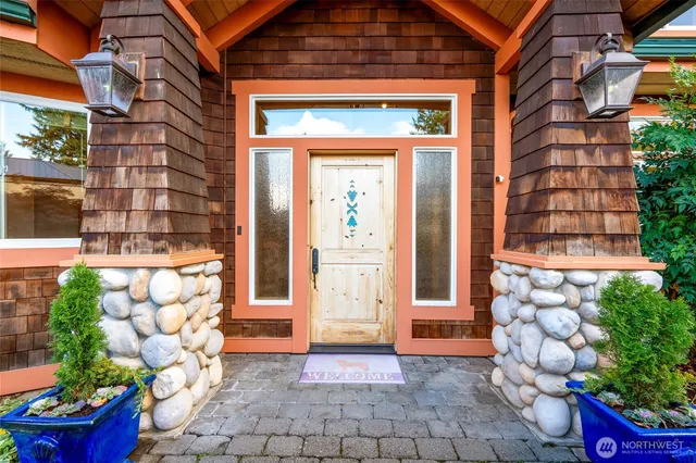 a view of a wooden door of the house