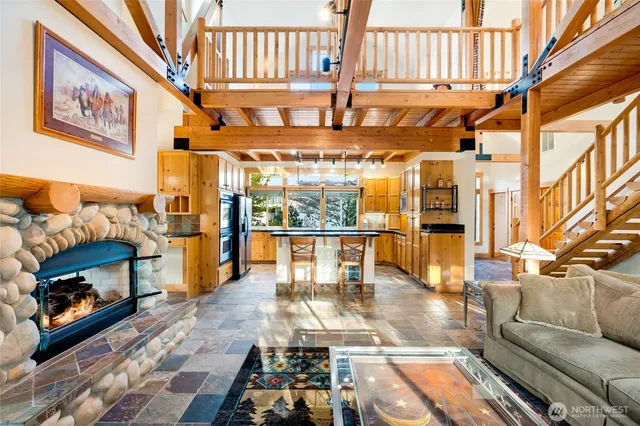 a view of a living room with a fireplace