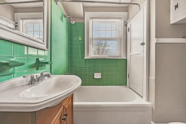 a bathroom with a sink a toilet and a bathtub