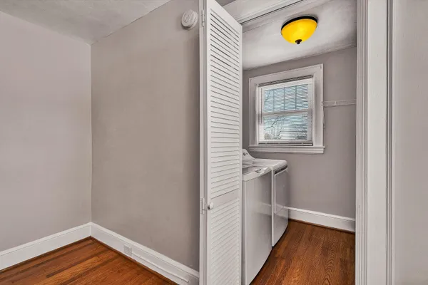 a view of hallway with wooden floor