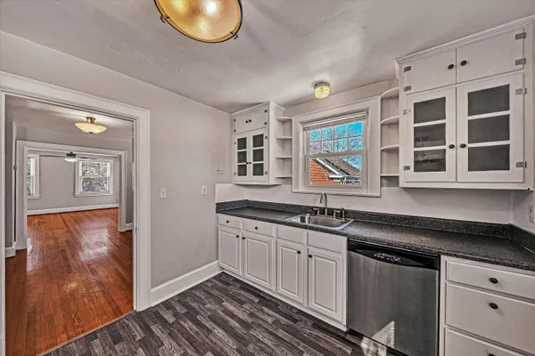 a kitchen with stainless steel appliances granite countertop a stove and a sink