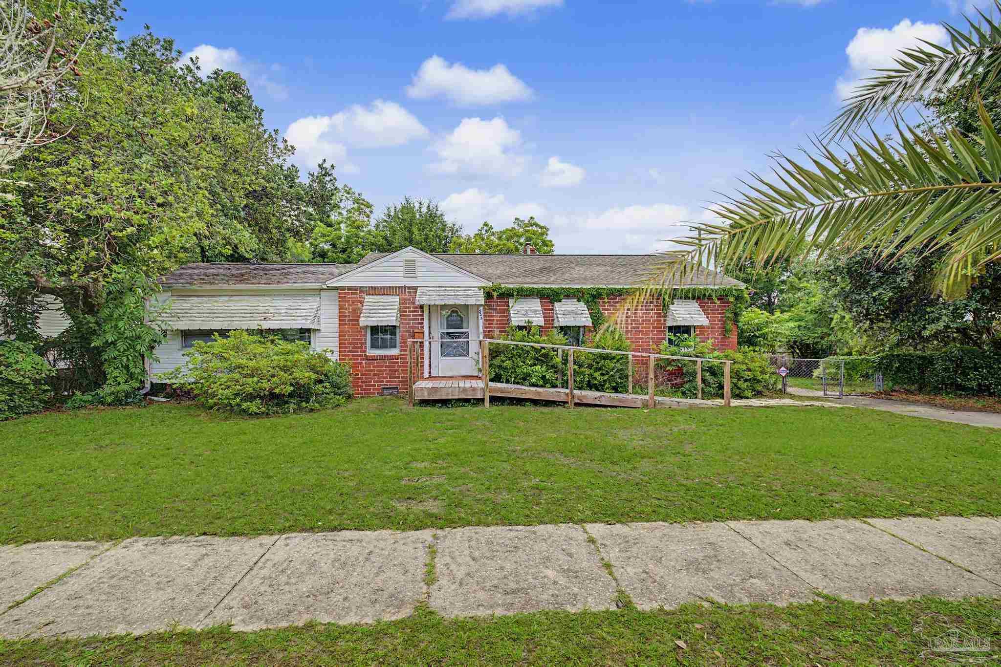 333 Gibbs Road Pensacola, FL 32507 - Photo 34 of 34 a front view of a house with a yard and garage