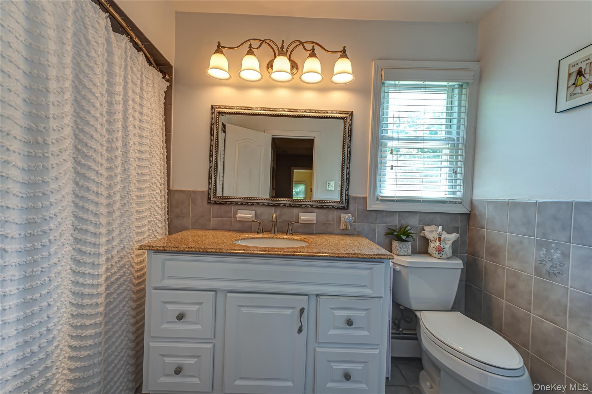 3 Thompson Hill Road St. James, NY 11780 - Photo 21 of 34 a bathroom with a sink a toilet and a bathtub