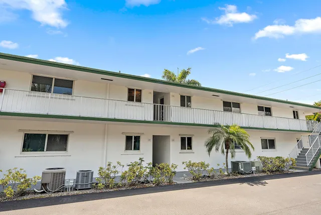 a front view of a house with garage