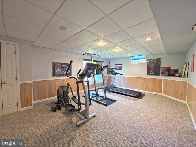 a bathroom with a sink a toilet a mirror and vanity
