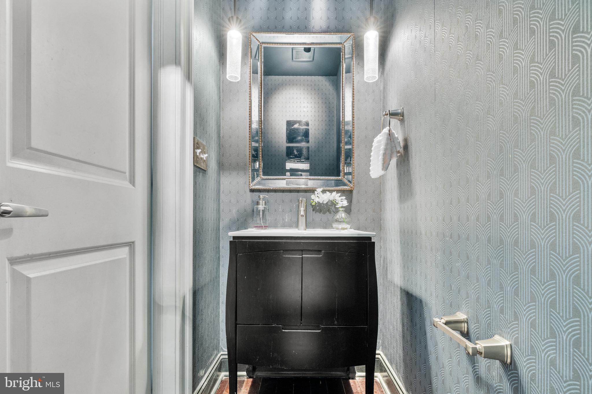 151 V Street Northwest, Unit 4 Washington, DC 20001 - Photo 26 of 49 a view of a bathroom with a sink mirror and toilet