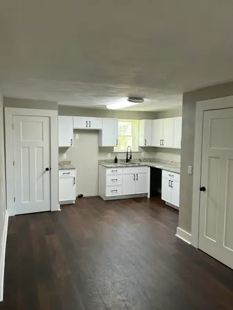 a view of a kitchen with electric appliances
