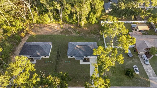 an aerial view of residential house with outdoor space