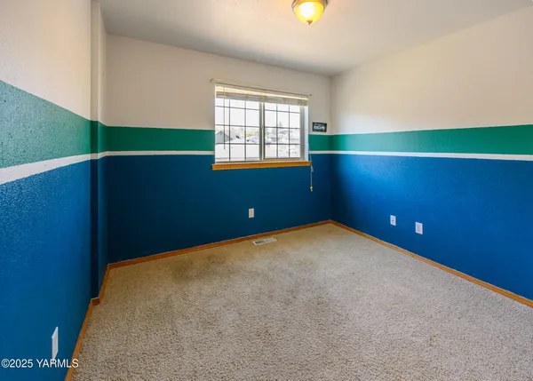 a bathroom with a sink a toilet and shower curtain